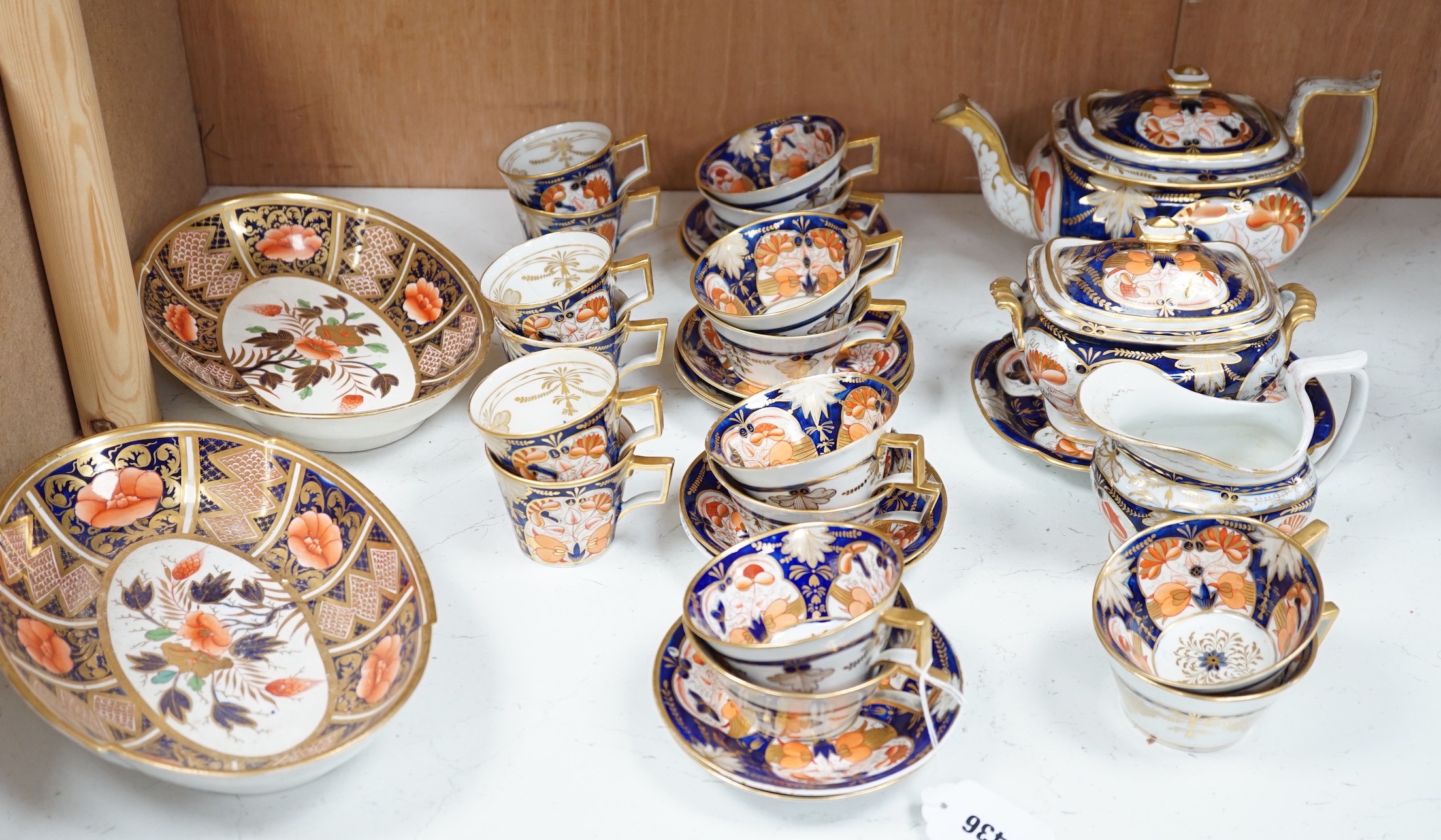 An early 19th century English porcelain Japan-pattern tea and coffee set and two similar dessert dishes